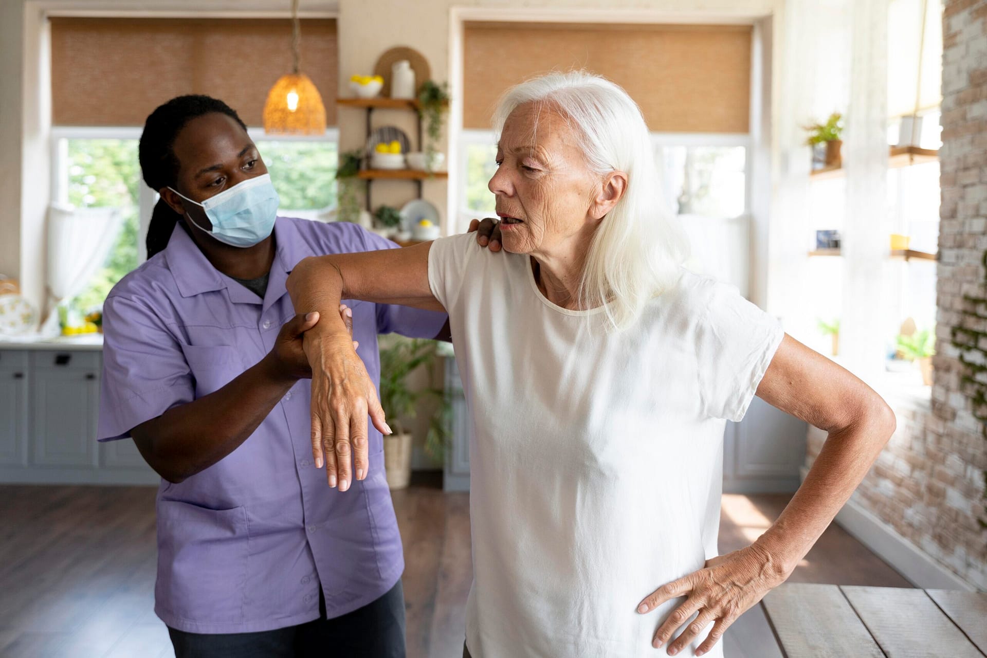 male-social-worker-taking-care-old-woman